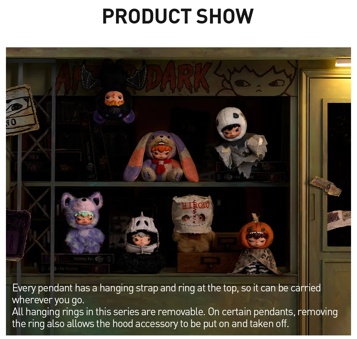 A promotional display showing multiple Halloween-themed character pendants arranged on shelves in a dark shop-like setting. The pendants include a purple cat, a tiger in a hat, a ghost figure, a zombie face, a pumpkin-headed character, and a small figure, with text explaining that the pendants have removable straps and rings and can be carried wherever you go.